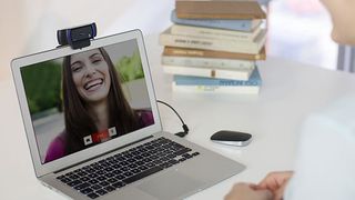 A business webcam mounted on a laptop