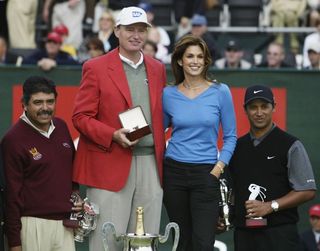 Big Ernie on the podium with Cindy Crawford in 2003