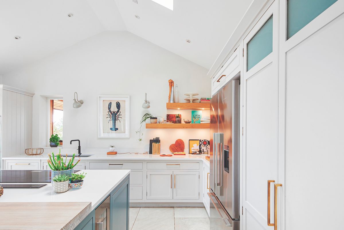white kitchen with open shelving and exposed beams