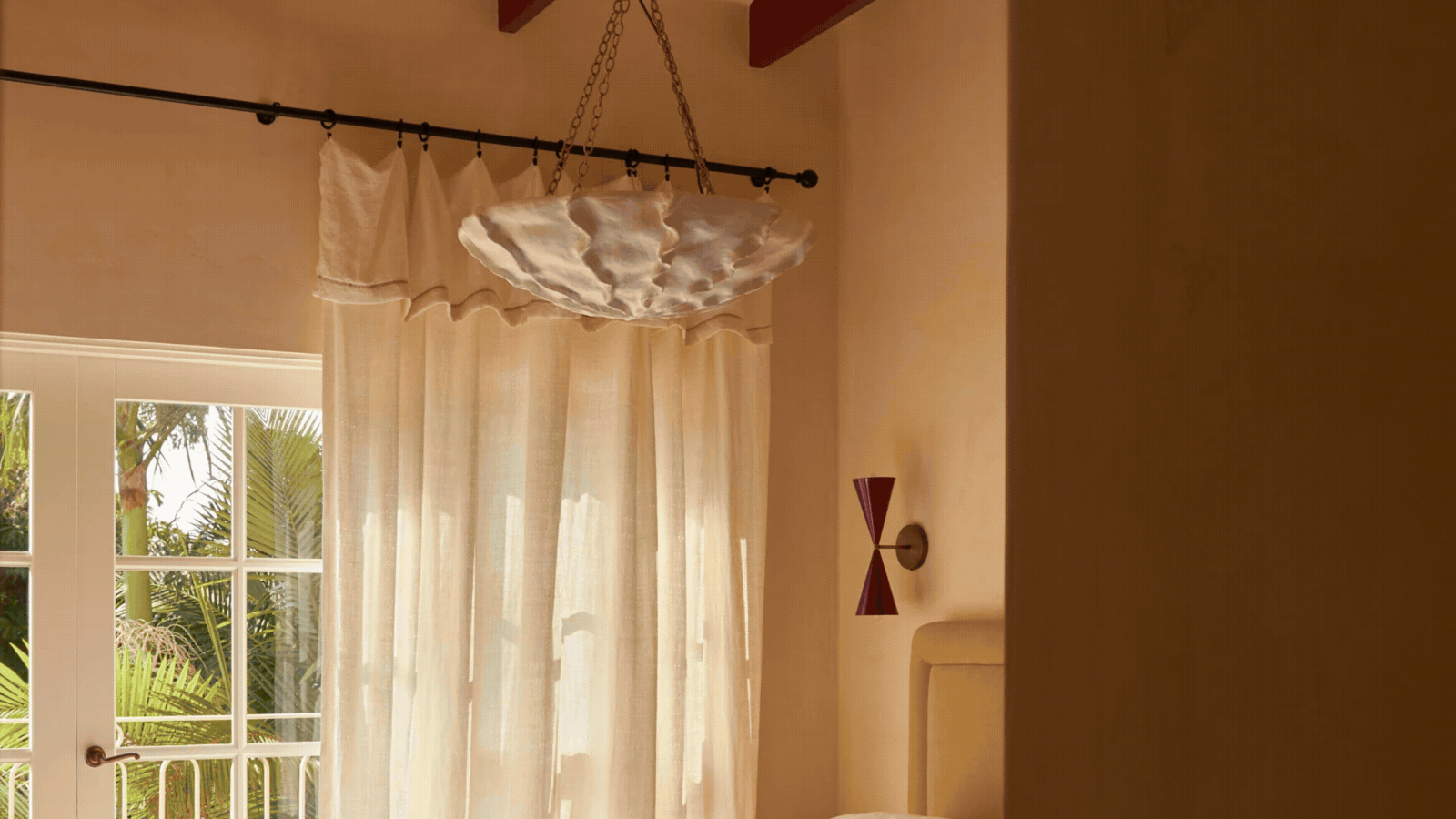 GIF showing three different images of a ruffle top curtain hanging on curtain rods in different rooms.
