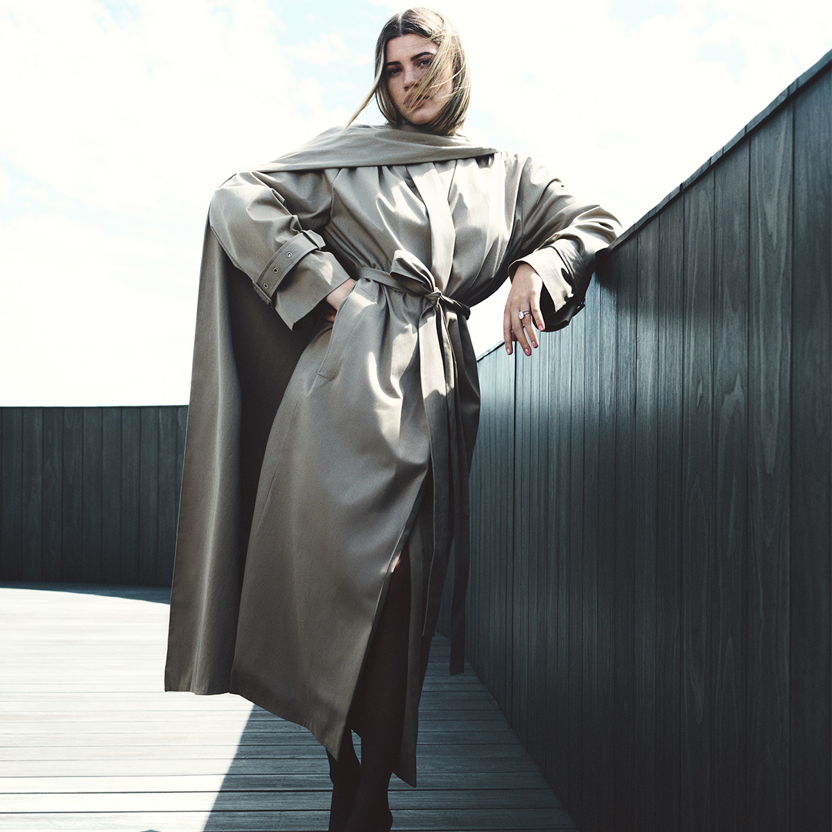 Sofia Richie Grainge wearing a trench coat from her new line, SRG.