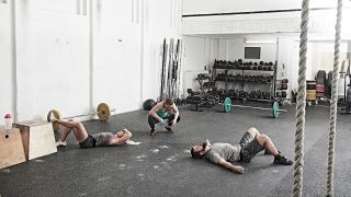 People resting on the gym floor