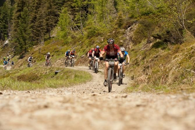 Riders on a gravel climb at the Bike Four Peaks