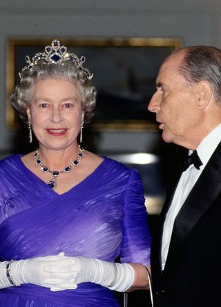 Queen Elizabeth II with President Mitterrand at a banquet on board the Royal Yacht Britannia