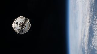 a cone-shaped spacecraft in space with earth visible on the left