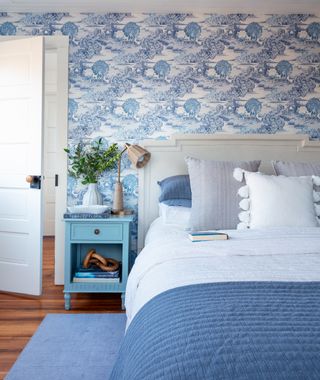 Blue bedroom with toile wallpaper