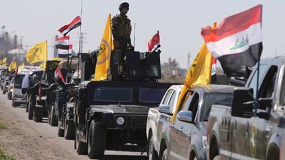 Iraqi security forces head towards the al-Dawr area, south of Tikrit