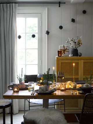 Nordic table setting with paper garlands and candles