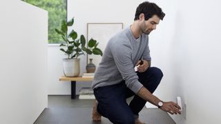 eero WiFi System Beacon being installed into an outlet