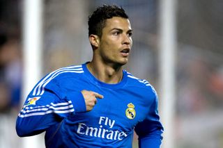 Cristiano Ronaldo celebrates after scoring for Real Madrid against Rayo Vallecano at Vallecas in November 2013.