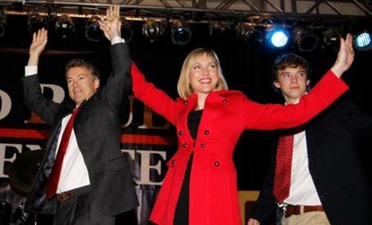 Tea Party favorite Rand Paul celebrates his Kentucky Senate seat victory with his wife, son, and supporters at an election night party.