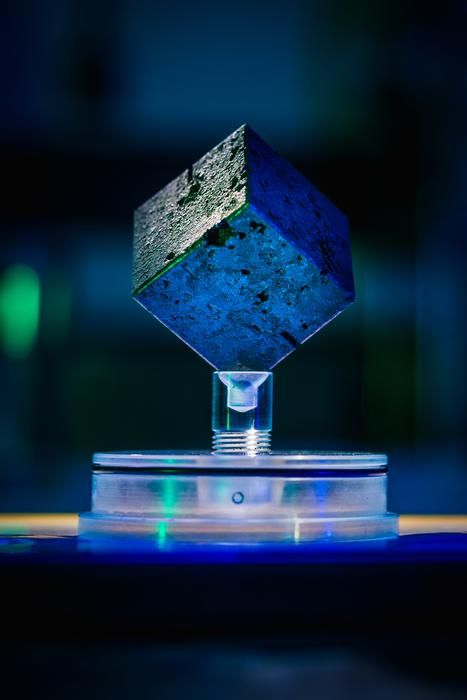 Uranium cube on a stand
