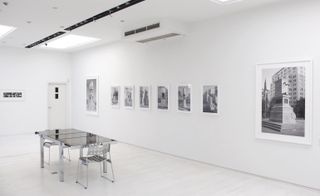 Photos from exhibition ’Voces: Latin American Photography 1980–2015’ on display in a white room