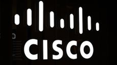 Cisco logo and branding illuminated in white against a black backdrop at Web Summit Qatar 2024.
