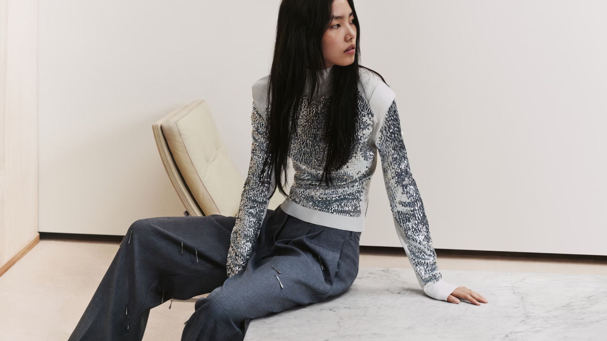 a model wears an embellished christmas jumper from H&amp;M