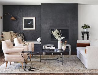 black and white living room with black walls and white furniture