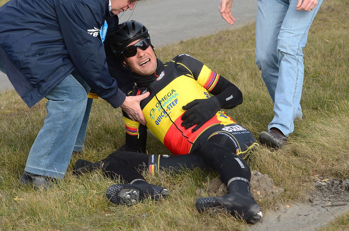 Tom Boonen lays in agony as rival Fabian Cancellara takes the win