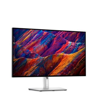 Dell UltraSharp U2720Q showing colorful mountains against a white background.