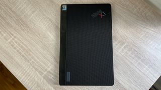 Lenovo ThinkPad X1 Fold 16 Gen 1 review unit on a desk, closed