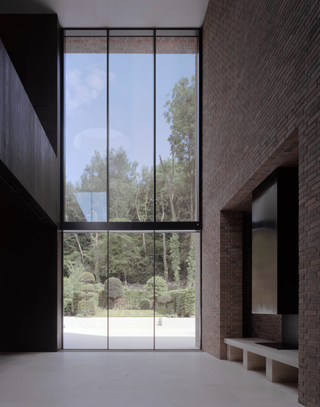 minimalist living room with very tall windows