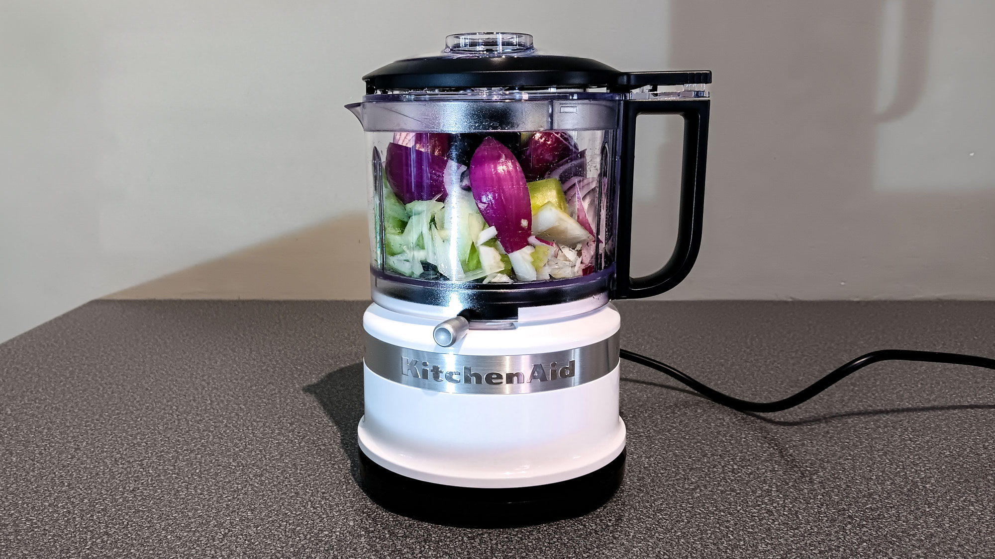 Chopped onion and celery in KitchenAid Food Chopper