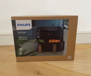Philips 3000 Series Dual Basket box on a wooden surface