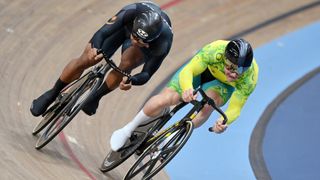 Matthew Richards (R), in green and yellow lycra, and Shah Sahrom (L), in black, compete in the of Team Malaysia compete in the Men's Sprint Track Cycling ahead of the 2024 Paris Olympic Games. 