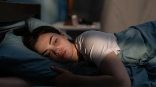 A young autistic woman struggles to fall asleep as there's too much light in her sleep environment