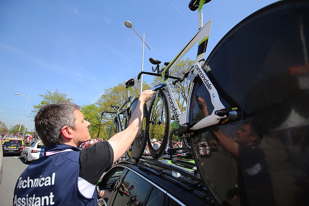 The UCI uses its special tablet to check bikes for mechanical doping during the Giro's opening stage.