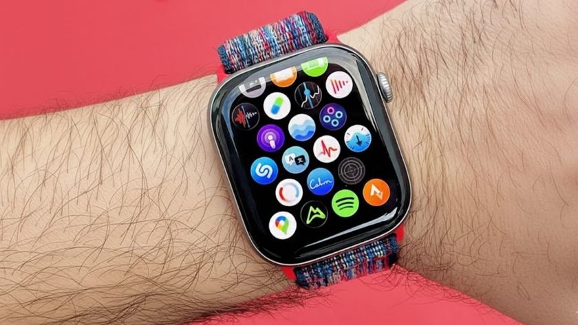 Close up of the Apple Watch 11 on a user's wrist with the app icon screen displayed