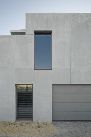Side view of the concrete walls of the house
