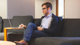 Man Working From Home on a Laptop