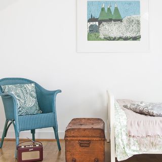 guest room with white walls and chair