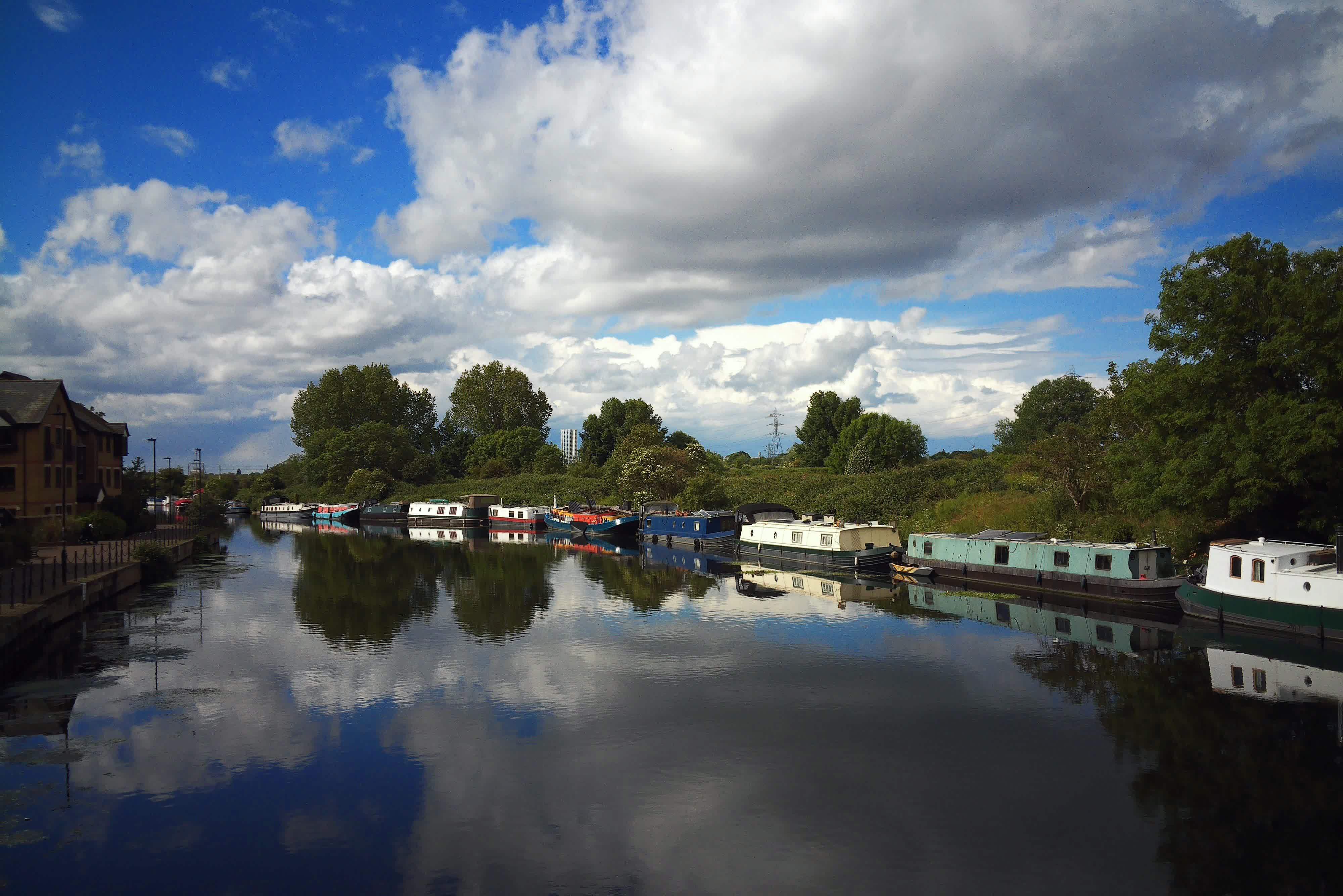 Photograph taken with the RewindPix digital compact showing a river scene with docked canal boats, colors are vivid but naturalistic