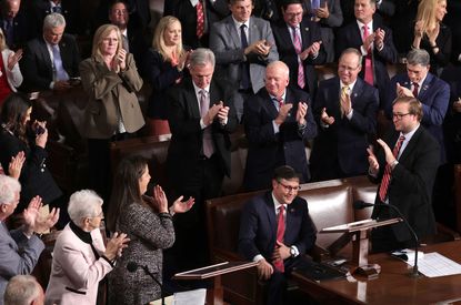 Mike Johnson (R-LA) surrounded by House Republicans 