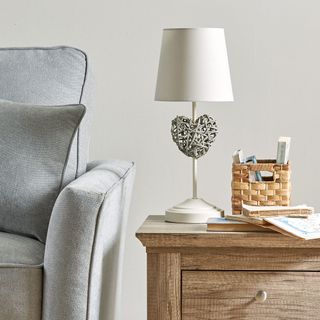 living room with grey sofa and table lamp