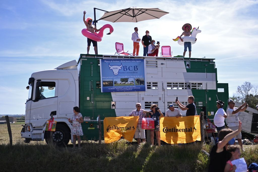 Fans cheer for the riders during the 14th stage of the 107th edition of the Tour de France cycling race 197 km between ClermontFerrand and Lyon on September 12 2020 Photo by Marco BERTORELLO AFP Photo by MARCO BERTORELLOAFP via Getty Images