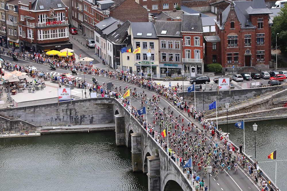 The peloton rides over a bridge during stage 4 of the 2015 Tour de France.