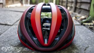 A front on view of a red and black helmet