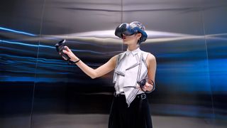 The HTC Vive Focus 3 being used by a woman in an office 