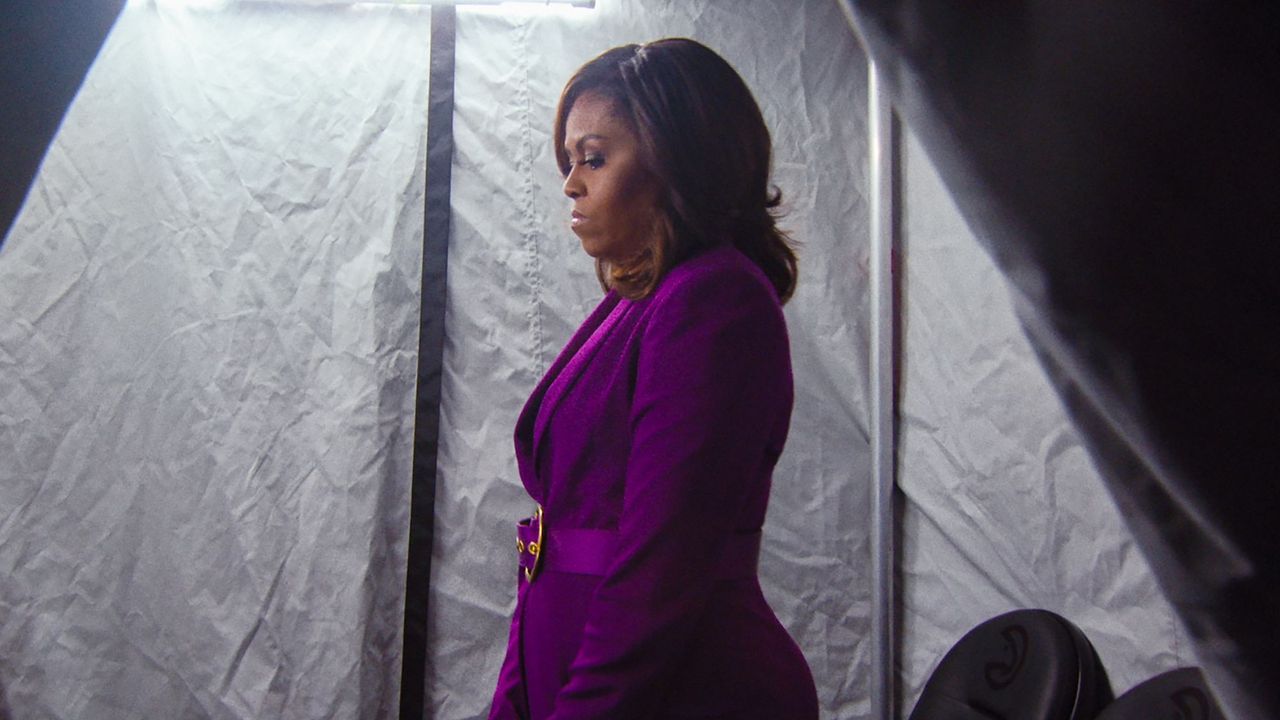 Michelle Obama in a purple suit before going on stage