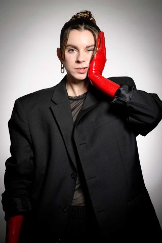 Lyndsey Gunnulfsen of the band Pvris poses for a portrait in red gloves