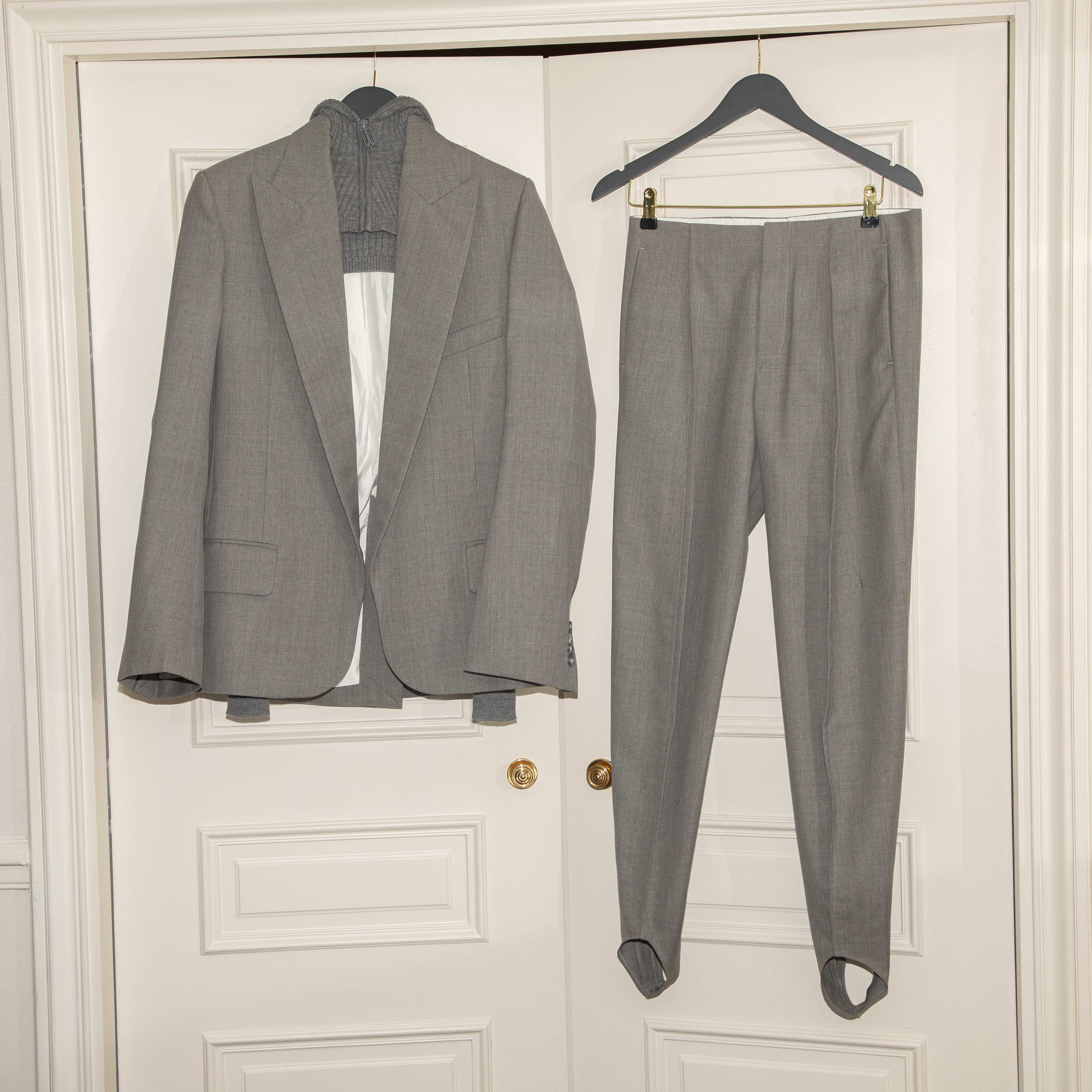 Paige DeSorbo gets ready for the Victoria Beckham Spring 2026 show during Paris Fashion Week wearing a gray suit set