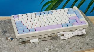 A pink, blue and white Gamakay TK75 Pro wireless mechanical keyboard with hot-swappable linear switches