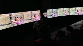 Value Electronics 2022 TV shootout -TVs arrayed in dark room