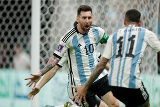 Lionel Messi celebrates after scoring for Argentina against Mexico at the 2022 World Cup.