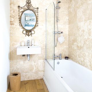 bathroom with mirror and wash basin