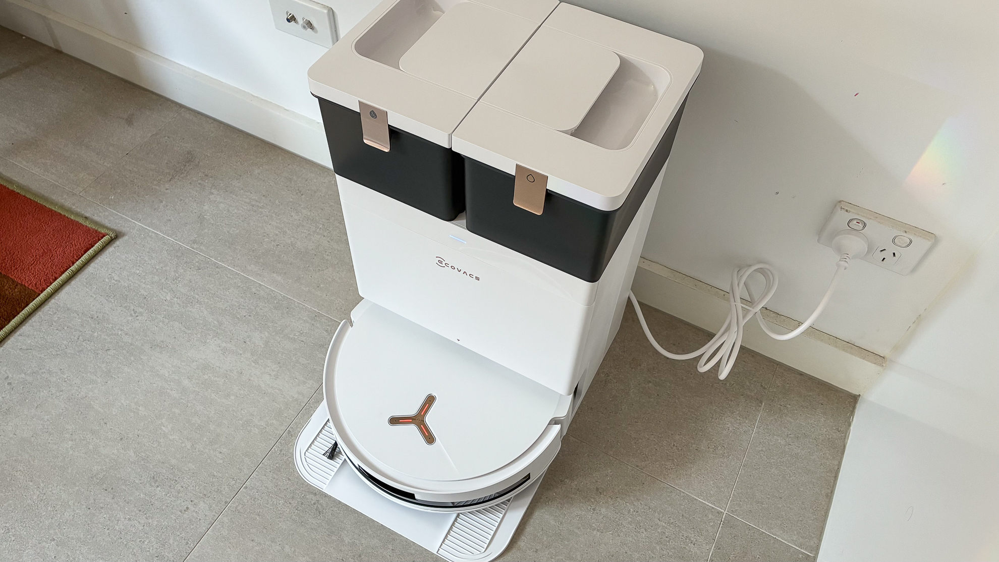 Ecovacs Deebot T50 Max Pro Omni plugged into a wall socket