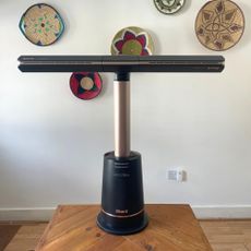 Shark TurboBlade fan on a wooden table in front of a white wall