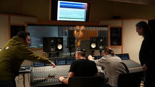 Students learn how to use a mixer at Sheffield studios with the help of Solid State Logic. 
